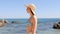 Woman in bikini walking on the beach on vacation