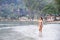 Woman in bikini is walking morning at beach