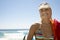 Woman In Bikini Wearing Visor Cap At Beach