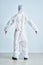 Woman in bio-hazard suit on white background.