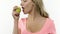 Woman bites pear