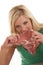 Woman biting a raw steak