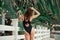 Woman in black bikini on summer vacation relax near resort outdoors
