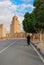 A woman in black clothes walking to the Great mosque in Kairouan, Tunisia