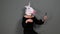 Woman in black dress and unicorn head talking via video conference - funny weird video