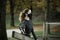 Woman with black face mask exercising in park during covid-19 epidemy