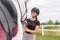 Woman with a black helmet stroking a chestnut horse head, close up shot