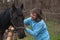 Woman and black horse