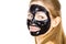 Woman with black peel off mask on face