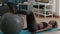 Woman with black skin training abs on swiss ball in living room