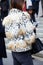 Woman with black, white and beige dappled fur jacket before Frankie Morello fashion show, Milan