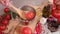 woman blanching tomato in pot with hot boiling water