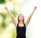 Woman in blank black tank top showing thumbs up