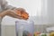 Woman blending carrot and other vegetables to make a healthy smoothie