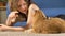 Woman blogger shoots video doing yoga exercises with cats
