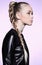 Woman with blonde hair plait in profile