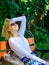 Woman blonde with sunglasses dream about vacation, take break relaxing in park. Dream vacation. Lady needs relax and