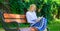 Woman blonde take break relaxing in park reading book. Reading literature as hobby. Favourite book. Girl sit bench