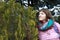 Woman with blooming cypress on Balgatura mountain