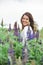 woman at blooming lupines field