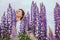 woman at blooming lupines field