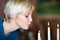 Woman Blowing Candle In Restaurant