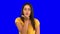 Woman blowing a kiss on blue screen