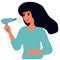 Woman blows her hair with a hairdryer, dries her hair, and combs her curls. After shower.