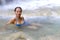 Woman with blue bikini happy in water at Erawan Waterfall