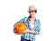Woman in blue checked shirt, hat holding orange pumpkin