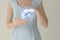 Woman in blue clothes holding virtual liver in hand. Handrawn human organ, detox and healthcare, healthcare hospital service