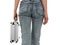 Woman in blue jeans with metal case