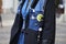 Woman with blue jeans shirt and Vivienne Westwood pins before Tod`s fashion show, Milan Fashion Week street