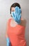 Woman with blue rubber glove make stop gesture