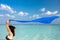 Woman with blue scarf on the tropical beach