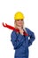 Woman in blue work clothes with pipe wrench