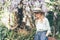 Woman in  boater  hat with wisteria