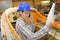 Woman in boatyard on telephone while looking at paperwork