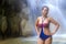 Woman body beautiful stand relax in waterfall with bikini