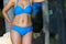 Woman body sexy symbol with bikini blue sunshine