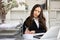 Woman bookkeeper writing on paper in office