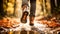 Woman in boots walking through muddy forest puddles in autumn