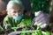woman botanist experimenting with microgreen plants