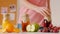 Woman bottles fresh juice fruit choosing orange