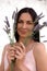 Woman with a bouquet of lavender on a white background. Aromatherapy with herbs