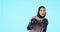 Woman, boxer and portrait in blue studio background with muslim for fitness, workout and wellness. Female boxing