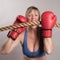 Woman boxer with red boxing gloves