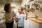 Woman and boy observing sculptures exhibition