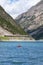 Woman with boy sailing on pedal boat on Lago di Livigno in Livigno, Italy