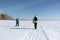 Woman and boy walking on a snowy trail on a frozen river, Russia, Novosibirsk